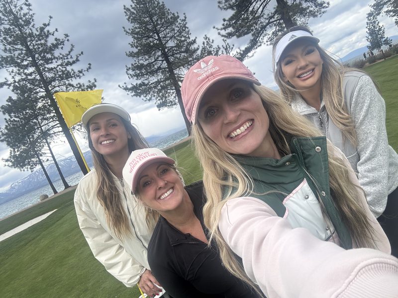 Four members lakeside on the green