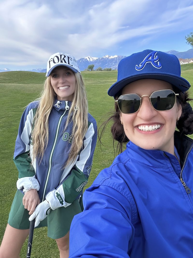 Two members with mountains in the background