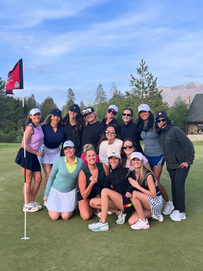 Girls on the Green members gathered on the 18th green at Lake Tahoe Golf Course at sunset